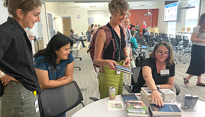 Workshop participants get their books signed by one of the invited authors